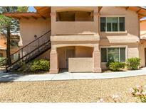 Charming two-story condo with a private balcony and landscaped grounds at 350 S Durango Dr # 103, Las Vegas, NV 89145