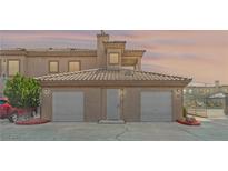 Charming townhouse featuring a two-car garage, well-maintained landscaping, and inviting entryway at 3608 Quetonia St # 204, Las Vegas, NV 89108