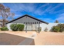 A cozy single-story home featuring low maintenance landscaping and a contemporary pergola at the entrance at 3924 Blackford Pl, Las Vegas, NV 89102