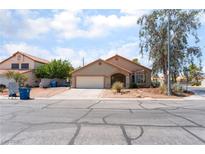 A charming single-story home with a well-maintained yard and attached two-car garage at 4335 Twin Peaks Dr, North Las Vegas, NV 89032