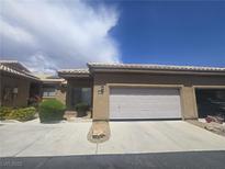 Charming single story home featuring an attached two car garage and desert landscaping at 4764 Wild Draw Dr, North Las Vegas, NV 89031