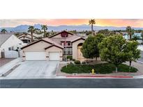 Charming single-story home featuring a well-manicured lawn, mature trees, and a three-car garage against a colorful sky at 6493 Yellow Bells Ct, Las Vegas, NV 89131