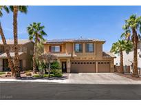 Inviting two-story home with desert landscaping, three-car garage, and solar panels at 815 Adagio St, Henderson, NV 89052