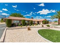 Charming single-story home with desert landscaping, green lawn, and mature trees on a sunny day at 9660 W Ann Rd, Las Vegas, NV 89149
