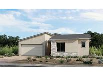 Beautiful single-story home with desert landscaping, a two-car garage, and stone accents at 12212 Elderwood St, Las Vegas, NV 89138