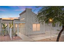 Charming single-Gathering home featuring a cozy front yard with secure white picket fence and desert landscaping at 2152 High Dunes Ln, Laughlin, NV 89029