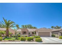 Charming single-story home showcasing a well-manicured lawn and desert landscaping at 2225 Blackburn Hills Ave, Henderson, NV 89044