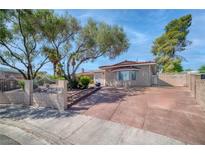 Charming single-story home featuring mature trees and a wide driveway at 2880 Placita Ct, Las Vegas, NV 89121
