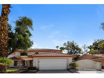 Charming two-story home featuring a tile roof, covered porch, and a two-car garage at 2924 Pleasant Lake Dr, Las Vegas, NV 89117