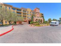 Elegant condo building featuring an inviting entrance and well-maintained landscaping at 30 Strada Di Villaggio # 441, Henderson, NV 89011