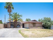Charming single-story brick home featuring desert landscaping and a two-car garage at 4516 E Flamingo Rd, Las Vegas, NV 89121