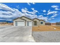 Attractive single-story home with a spacious three-car garage and a low-maintenance desert landscape at 4801 Stoneham, Pahrump, NV 89061