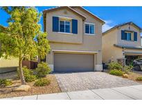 Charming two-story home with a landscaped yard and a two-car garage at 8295 Nebula Cloud Ave, Las Vegas, NV 89131