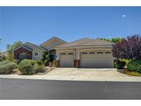 Charming single-story home featuring a large three-car garage and well-maintained landscaping at 905 Star Pine Dr, Las Vegas, NV 89144