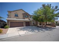 Charming two-story home featuring a three-car garage and well-maintained landscaping at 9660 Drayton Ave, Las Vegas, NV 89148