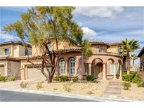 Charming two-story home featuring a stucco exterior, tiled roof, and a well-maintained, xeriscaped front yard at 12116 Vista Linda Ave, Las Vegas, NV 89138