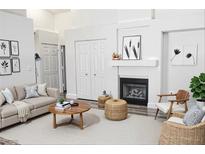 Bright living room features fireplace, modern décor, and a comfortable seating area at 1624 N Torrey Pines Dr # 101, Las Vegas, NV 89108