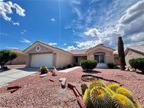 Charming single-story home with desert landscaping and a two-car garage at 2405 Indigo Valley St, Las Vegas, NV 89134