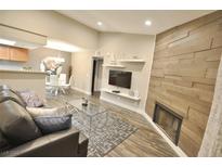 Inviting living room featuring a fireplace, modern furnishings, and an open floor plan at 4200 S Valley View Blvd # 3074, Las Vegas, NV 89103