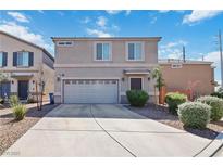 Two-story home features desert landscaping, a two-car garage, and a well-maintained front yard at 4976 Quiet Morning St, Las Vegas, NV 89122