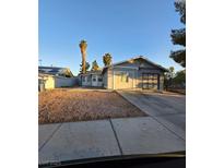 Charming single-story home featuring a low-maintenance gravel yard and attached two-car garage at 5615 Blue Sea St, Las Vegas, NV 89110