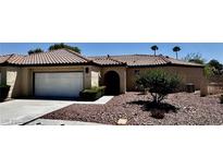 Charming single-story home featuring a tile roof, two-car garage, and mature landscaping at 7273 Vista Bonita Dr, Las Vegas, NV 89149