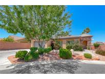 Charming single-story home featuring a landscaped front yard, desert foliage, and a stone-accented entryway at 7606 Kenwood Hills Ct, Las Vegas, NV 89131