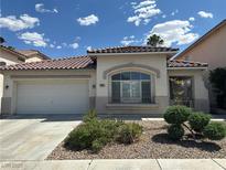 Charming single-story home featuring a tile roof, two-car garage, and well-maintained front yard at 8337 Ruby Heights Ave, Las Vegas, NV 89117