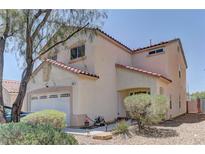 Charming two-story home featuring a two-car garage and low maintenance landscaping at 9091 Jumping Jacks Ave, Las Vegas, NV 89178