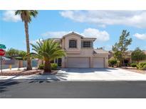 Charming two-story home featuring a three-car garage, desert landscaping, and a welcoming facade at 1063 Silver Star St, Henderson, NV 89002