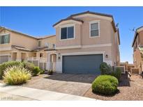 Two-story home featuring low maintenance landscaping and a brick driveway at 1165 Cactus Rock St, Henderson, NV 89011