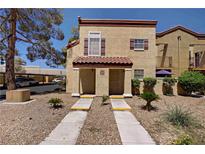 Charming condo featuring a well-maintained facade with desert landscaping, inviting entrance, and multiple windows at 2801 N Rainbow Blvd # 273, Las Vegas, NV 89108