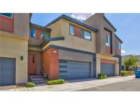 Modern townhouse featuring a two-car garage and contemporary design at 3219 Timorasso Ave, Henderson, NV 89044
