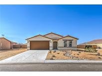 Charming single story home with a two car garage and low maintenance desert landscaping at 3665 E Garfield Dr, Pahrump, NV 89061