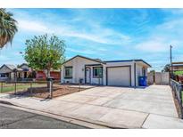 Charming single-story home featuring a well-maintained yard, mature tree, and a private driveway at 4432 Ash Ave, Las Vegas, NV 89110