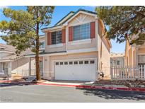 Two-story home featuring a two-car garage, neutral stucco, and mature landscaping at 5228 Shasta Lake Way, Las Vegas, NV 89118