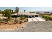 Stunning single-story home boasts mature landscaping, a three-car garage, and a spacious driveway at 8290 Gagnier Blvd, Las Vegas, NV 89113