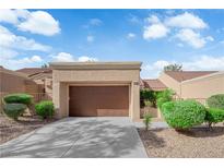 Charming one-story home features an attached garage, desert landscaping, and a well-maintained exterior at 9424 Gold Mountain Dr, Las Vegas, NV 89134