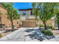 Charming two-story home with a two-car garage and well-manicured landscaping at 10312 Glimmering Star Dr, Las Vegas, NV 89178