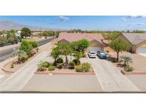 Charming single-story home with manicured landscaping, spacious driveway, and mountain views at 8808 Homestead Rd, Las Vegas, NV 89143