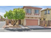 Charming two-story home with a well-maintained front yard and attached garage at 10601 Lessona St, Las Vegas, NV 89141