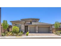 Attractive single-story home with a two-car garage, desert landscaping, and neutral color scheme at 12295 Skyracer Dr, Las Vegas, NV 89138