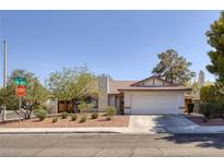 Charming single-story home featuring a well-maintained front yard and a two-car garage at 3129 White Rose Way, Henderson, NV 89014