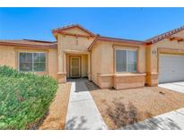 Charming single-story home with well-kept landscaping and cozy front entrance at 3604 Cantura Crest Ct, North Las Vegas, NV 89031