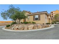 Charming home featuring a well-maintained yard with natural rock landscaping at 4 Via Centrale # 1, Henderson, NV 89011