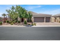Charming single-story home featuring a stone facade, three-car garage, and well-manicured landscaping at 7230 Fresh Harvest Ave, Las Vegas, NV 89131