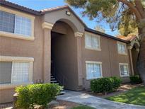 Two-story apartment building with well maintained landscaping and classic architectural details and a nice entryway at 2750 S Durango Dr # 2141, Las Vegas, NV 89117