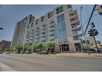 Contemporary high-rise condo building featuring balconies and expansive windows offers an upscale urban living experience at 353 E Bonneville Ave # 313, Las Vegas, NV 89101