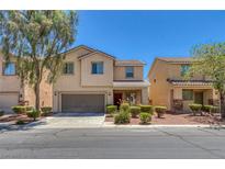 Inviting two-story home featuring a well-maintained yard and attached two-car garage, perfect for Gathering living at 5484 Mercury Springs Dr, Las Vegas, NV 89122