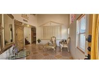 Grand foyer with decorative tile flooring, ornate furniture, and plenty of natural light at 6275 Allspice Ct, Las Vegas, NV 89142